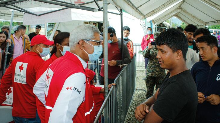 IFRC Secretary General Jagan Chapagain speaks to people on the move in Darien province, Panama, in August 2022 where the Panamanian Red Cross is providing humanitarian assistance to those who need it on their journeys.